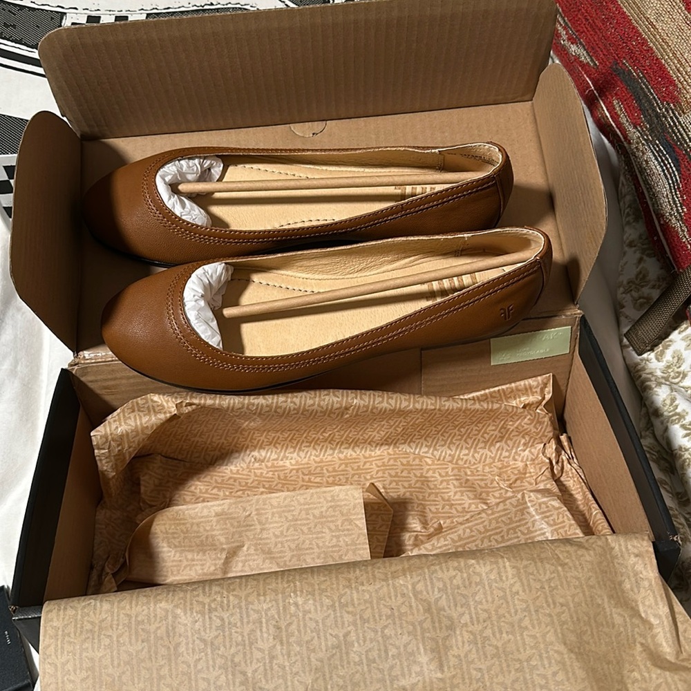 NEW in box. Never worn. Frye brown leather flats.